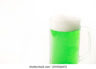 A Pint Of Green Beer For St Patrick's Day On A White Background. Traditional Irish Drink For A Holiday