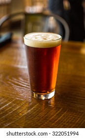 Pint Of Pale Ale On Pub Table