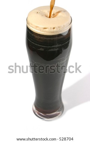 Pint of stout being poured