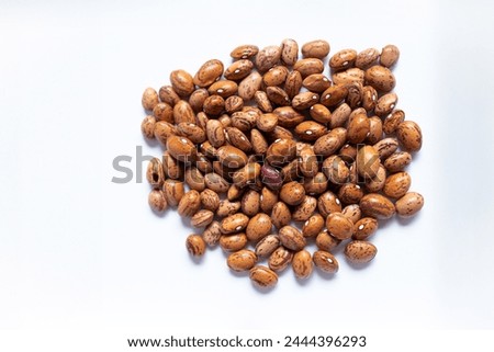 Pinto beans on the white background 