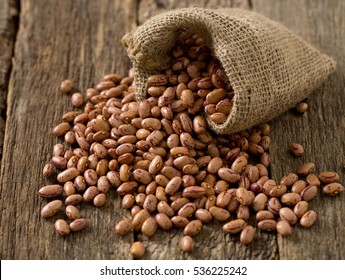 Pinto Beans On Wooden Surface