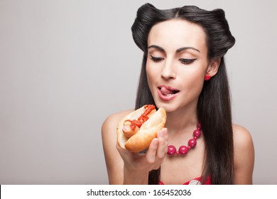 pinup styled girl wants to eat hot dog