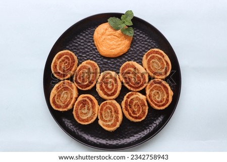 Pinwheel Samosa, are small bite sized snacks in the shape of a pinwheel and filled with a spicy potato stuffing, baked or fried,  starter or appetizer