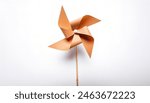 pinwheel or windmill paper origami isolated on white background simple starter craft for kids for weekend entertainment. ESG and Clean Energy Concept. Wind Turbine Paper into the Sky. Decrease Carbon