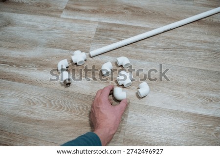 Pipe Assembly Guide. Demonstration Of Fitting Couplings And Connectors On Wood Surfaces. Comprehensive Guide To Assembling Pipe Fittings And Connectors On Wooden Floors For Tutorials And Renovations