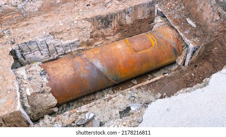 Pipe break underground.  Replacement of the pipe section by welding as a result of an accident. Repair of a section of iron pipe due to corrosion. Welding seam on the pipe.