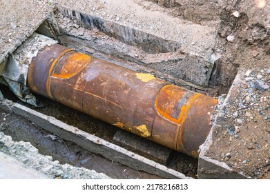 Pipe break underground.  Replacement of the pipe section by welding as a result of an accident. Repair of a section of iron pipe due to corrosion. Welding seam on the pipe.