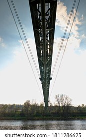 Pipe bridge construction based on superheated steam support pipes for heating housing estates. Suspension pipe bridge over river.