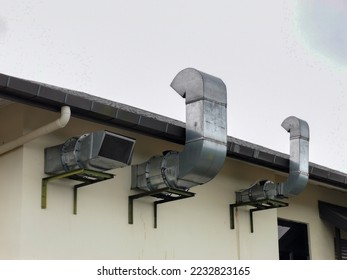 Pipe chimney on the outside wall of restaurant kitchen. - Shutterstock ID 2232823165