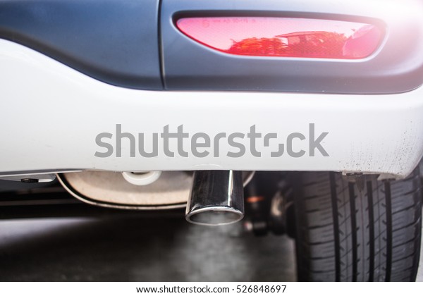Pipe\
exhaust car smoke emission, Air pollution\
concep.