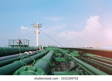 Pipe Line On Tanker Ship At The Large Tank, Oil Under Loaded At Main Deck With Mast Ship Front Ship