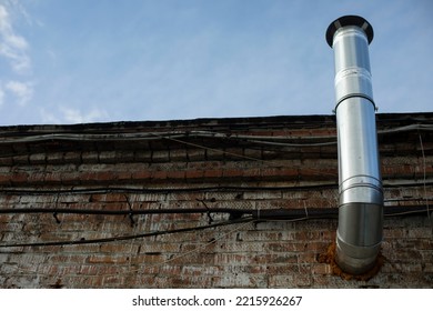 Pipe On Building. Industrial Building. Wall Of Bricks. Industrial Building.