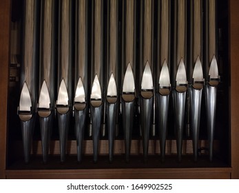 Pipe organ in Catholic church, pipe part close up

in low light.