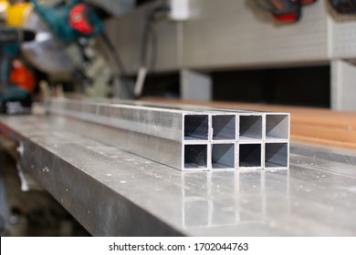 The pipe sections. Aluminium profile for manufacturing. Structural metal aluminium shapes. Aluminium profiles texture for constructions.