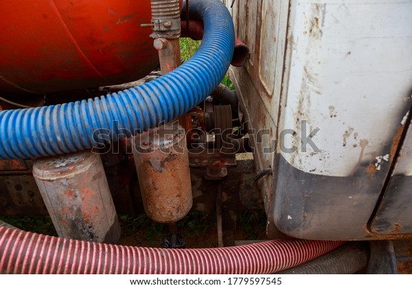 Pipe of a Sewage Pumping Machine. Providing\
Sewer Cleaning Service\
Outdoor.