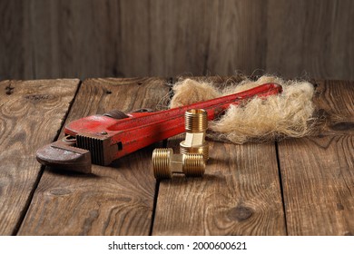 Pipe Wrench With Tow On A Wooden Table