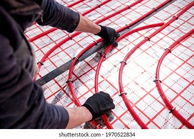 Pipefitter install system of underfloor heating system at home