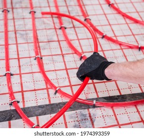 Pipefitter install system of underfloor heating system at home