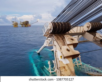 Pipelaying Vessel With A Pipeline Stinger In The Water During Subsea Pipeline Construction/installation With An Oil And Gas Platform In The Vicinity - South China Sea, Malaysia