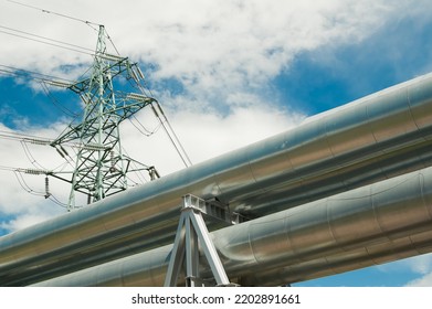 Pipeline And Power Lines On The Background Of Blue Sky And Clouds.