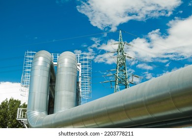 Pipeline And Power Lines On The Background Of Blue Sky And Clouds.