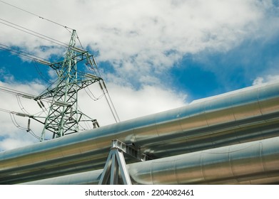 Pipeline And Power Lines On The Background Of Blue Sky And Clouds.