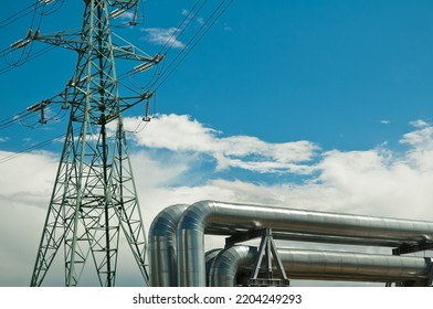 Pipeline And Power Lines On The Background Of Blue Sky And Clouds.