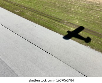 Piper Cub Airplane Shadow On Runway
