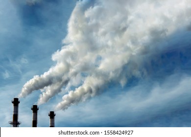 Pipes Of An Industrial Building Releasing Dirty Gray-green Smoke Into The Sky. Air Pollution, Environmental Issue, Toxic Substances Entering The Atmosphere