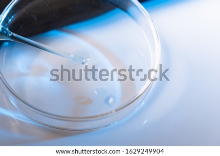 Pipette adding fluid to several test tubes