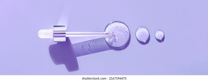 Pipette Drop Of Serum Test On A Purpule Background