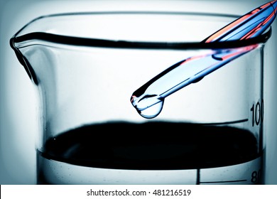 Pipette and laboratory glass. Science concept. - Shutterstock ID 481216519