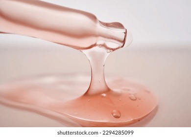 Pipette with a viscous pink cosmetic close-up. - Powered by Shutterstock