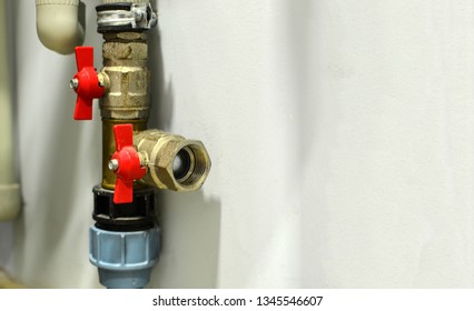  Piping and plumbing fitting in the home  industry of the modern era. Connecting pipe warm water floor to the manifold heating. Plumbing Pipes and Fixtures. 