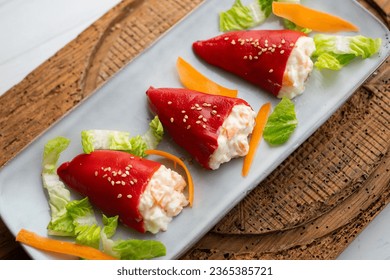 Piquillo peppers stuffed with mayonnaise and prawns. Traditional Spanish tapa. - Powered by Shutterstock