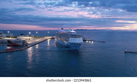 Piraeus Port, Attica - Greece - September 27 2022: Aerial Drone Photo Of Huge Brand New Cruise Liner Odyssey Of The Seas Anchored In Port Of Piraeus