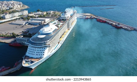 Piraeus Port, Attica - Greece - September 27 2022: Aerial Drone Photo Of Huge Brand New Cruise Liner Odyssey Of The Seas Anchored In Port Of Piraeus