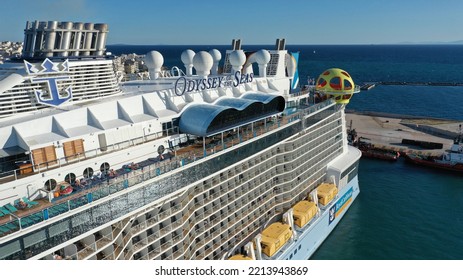 Piraeus Port, Attica - Greece - September 27 2022: Aerial Drone Photo Of Huge Brand New Cruise Liner Odyssey Of The Seas Anchored In Port Of Piraeus