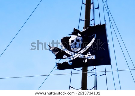Pirate flag on the mast of a schooner.