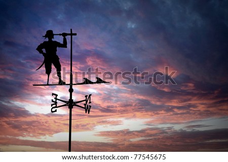 pirate weathercock against sunset
