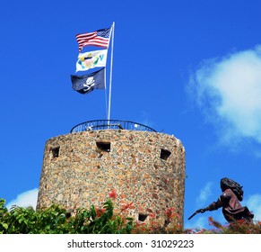 Pirate's castle in Charlotte Amalie town with three flags on a top (St.Thomas, U.S.Virgin Islands).
