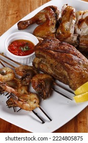 Piri Piri Chicken, Skewered Gambas And Roasted Pork