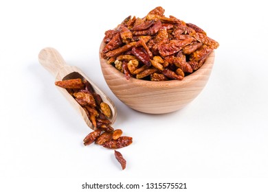 Piri Piri Pepper In Wooden Bowl And Scoop Isolated On White Background. Closeup.