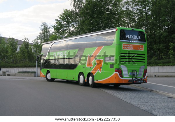 Pirna, Germany, 05-13-2019, a green bus of the\
FlixBus company at the bus station in Pirna, a small city at the\
river Elbe located