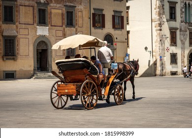 PISA, ITALY - JULY 29, 2020: Sightseeing Tour in a Horse-drawn Carriage in Pisa Downtown, Square of the Knights (Piazza dei Cavalieri). Tuscany, Italy, Europe