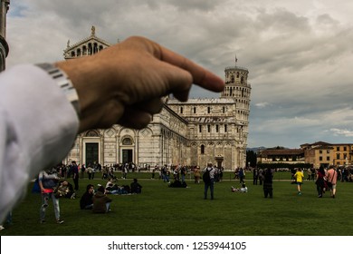 Pisa, Italy, May 1st 2014. Joking With The Tower Of Pisa And The Perspective