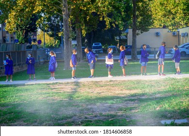 PISA, ITALY - SEPTEMBER 14, 2020: Elementary School Mates Maintain Distance Entering First Day Of School.