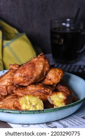 Pisang Goreng; An Indonesia Street Snack Contain Deep Fried Sweet Bananas Cover With Flour. Photograph Close-up In Night Time With Dark Mood. 