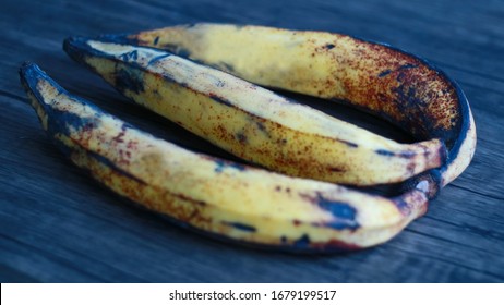 Pisang Tanduk Or Rhino Horn Plantains On Wood Background.