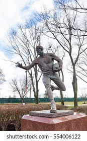 PISCATAWAY, NEW JERSEY - January 4, 2017: A View Of The Football Player Sculpture On The Scarlet Walk At Rutgers University Busch Campus